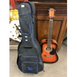 A Rikter acoustic guitar with case