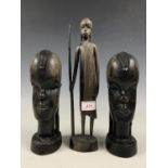 Two African carved wooden busts and a figurine