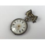 A Victorian lady's silver cased fob watch on a silver bow-shaped suspender, having crown wound