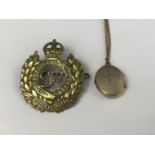 A Second World War Royal Engineers brass cap badge together with a related rolled-gold pendant