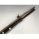 A Victorian sporting longbow, together with an antique billiards snooker cue