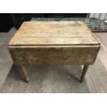 A Victorian pine drop-leaf kitchen table