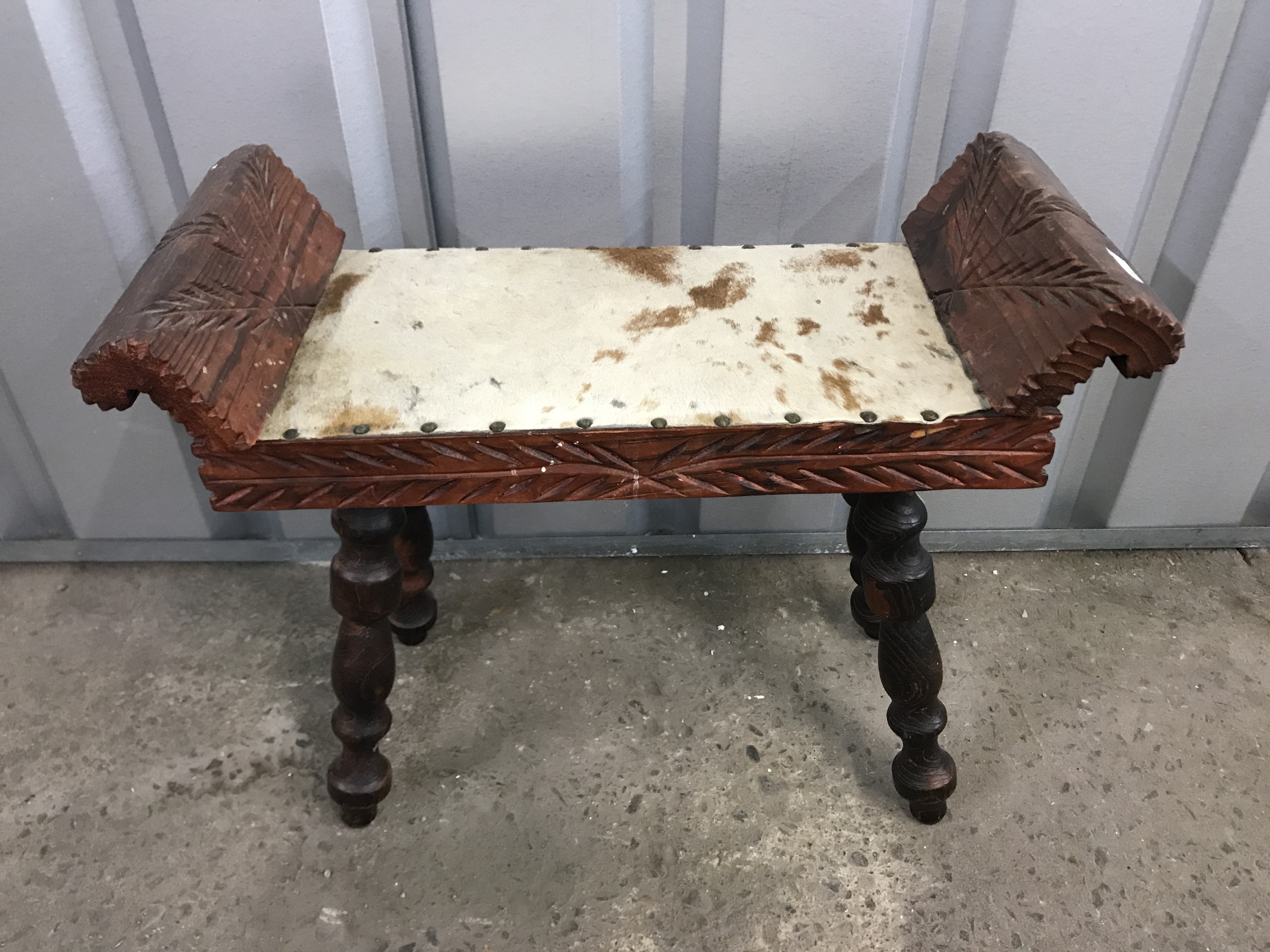 A carved oak stool