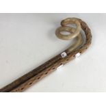 A vintage horn handled walking stick together with a Blackthorn stick