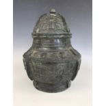 A Chinese archaic style ritual bronze covered vessel, 29 cm high