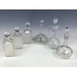 Three late 19th Century cut glass spirit decanters (one neck a/f) together with a pair of