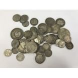 A small quantity of Victorian and pre-1947 British silver coins including an enamelled 1887 4d