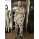 A mannequin and King's Own Royal Border Regiment desert camouflage clothing