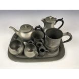 A Sillustre hammered pewter tea set with tray together with a 19th century quart and other measures
