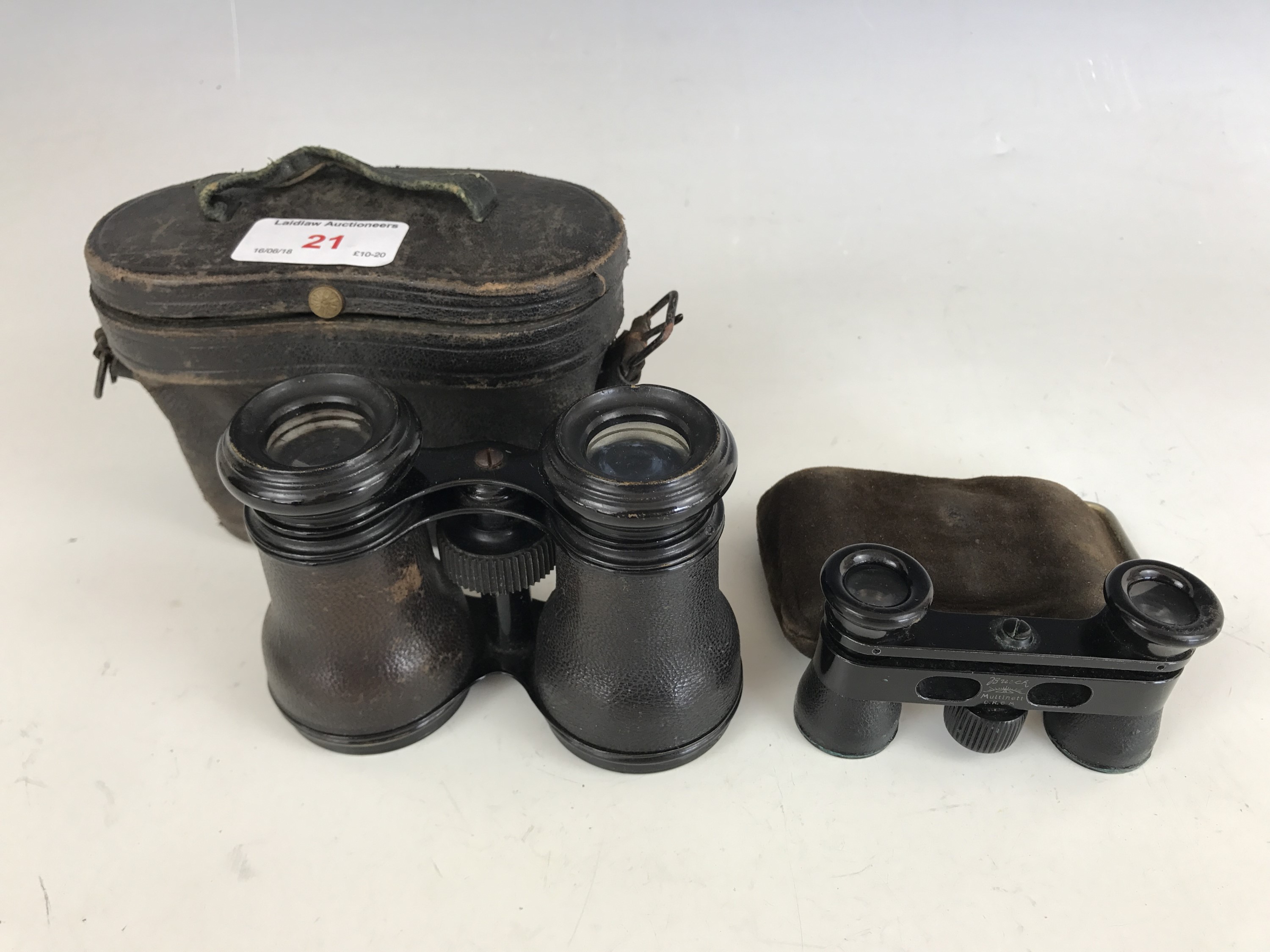 A cased pair of Busch Multinett D.R.G.M opera glasses together with one other pair