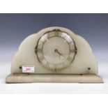 A 1950s alabaster mantel clock