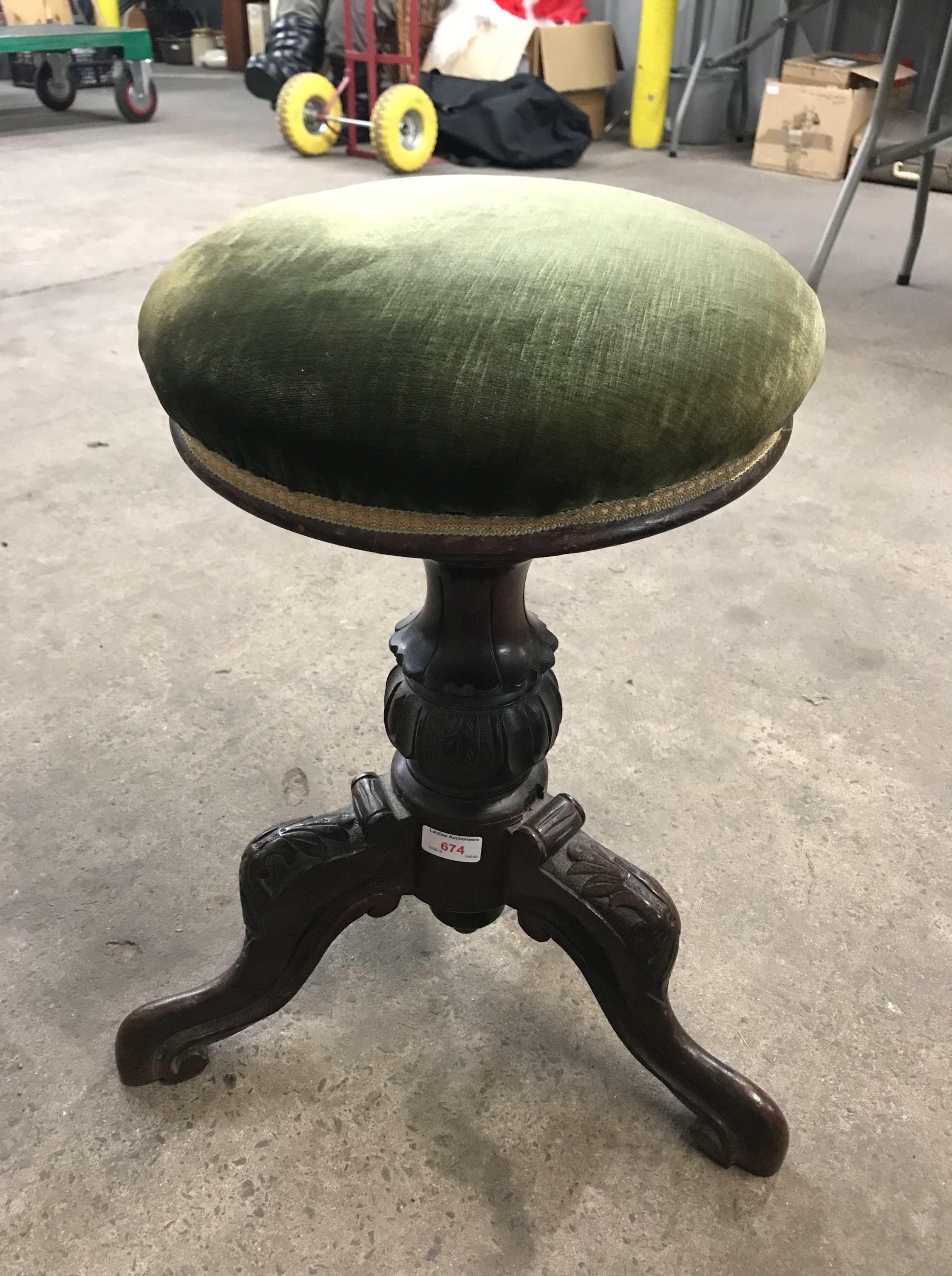 A Victorian tripod piano stool