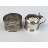 A Henry Griffiths silver napkin ring together with a silver mustard