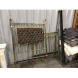 A Victorian upholstered brass single bed stead