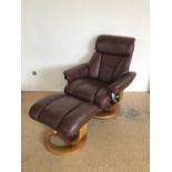 A contemporary Global Furniture Alliance / GFA recliner armchair and Ottoman footstool