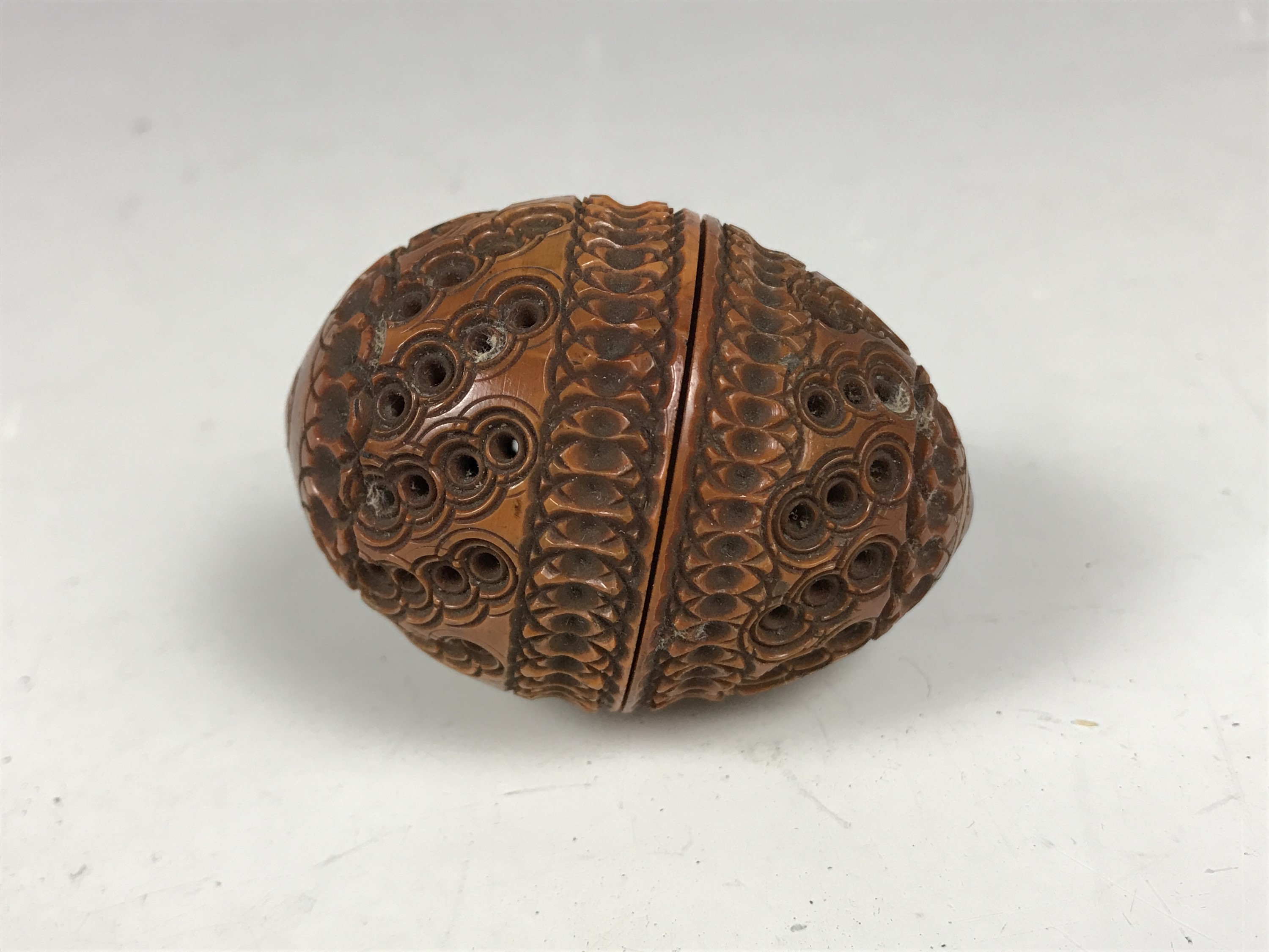 A 19th Century carved coquilla nut pocket pomander