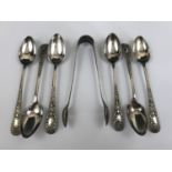 A set of six electroplate coffee spoons with matching sugar tongs