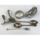 A silver mounted swan form salt together with a silver napkin ring, a child's silver food pusher and