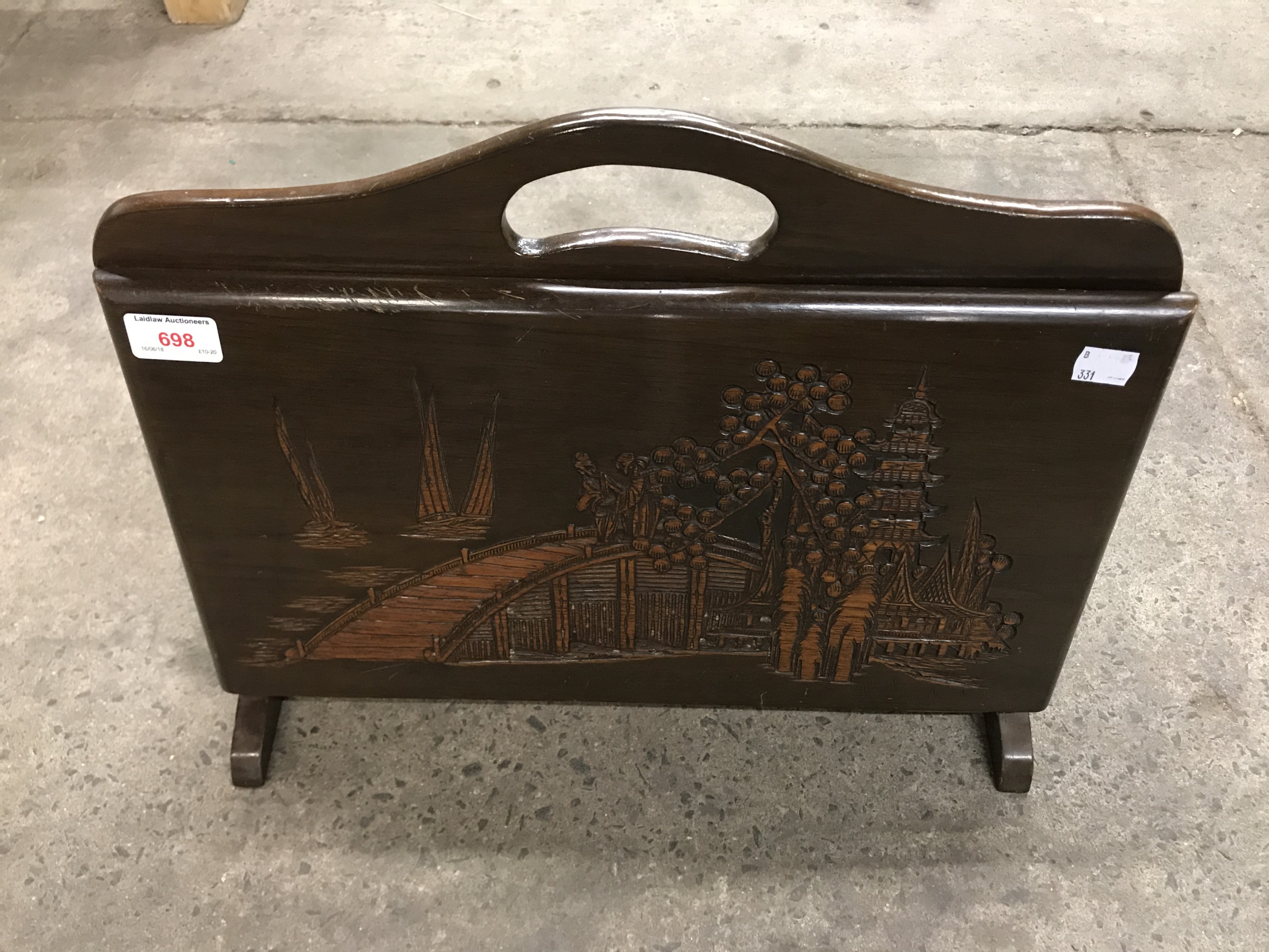 A mid 20th Century Chinese carved hardwood magazine rack