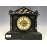 A Victorian black slate mantel clock