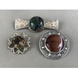 Three Robert Allison silver and hardstone brooches, of Celtic design, including one set with moss