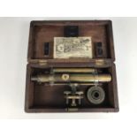 A 19th Century lacquered brass surveyor's level by T. B. Winter and Son, in original fitted mahogany
