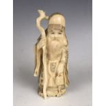 A Japanese marine ivory okimono depicting the Lucky God Fukurokuju, mid 20th Century, 12.5 cm