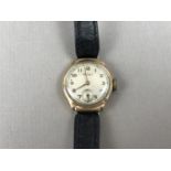 A 1930s lady's 9ct gold cased Rotary wrist watch, having a circular silvered dial, gilt Arabic