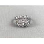 A vintage diamond and 18ct white gold cocktail ring, in a cluster arrangement, comprising three