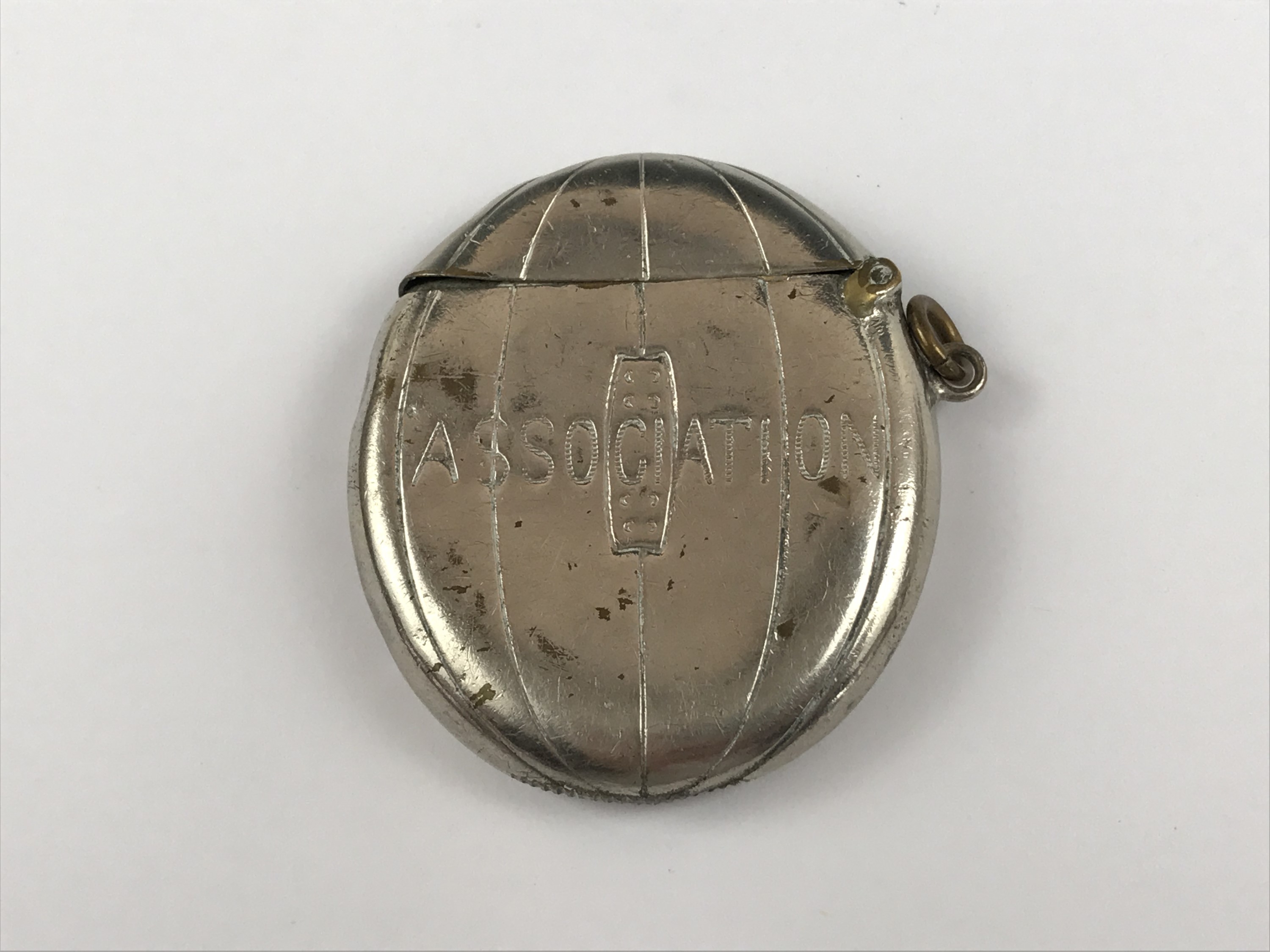 A Victorian Football Association silver-plated vesta case modelled in the form of a laced leather