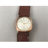 A 1940s Helvetia 9ct gold wrist watch, having a tonneau shaped case and circular face with applied