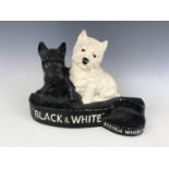 A Brentleigh Ware painted plaster Black & White Scotch Whisky advertising stand and a similar