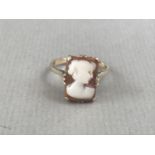 A vintage cameo dress ring, the face of rectangular section, carved with the profile of a young