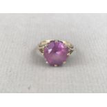 A vintage amethyst cocktail ring, having a circular-cut stone of approximately 12mm diameter,