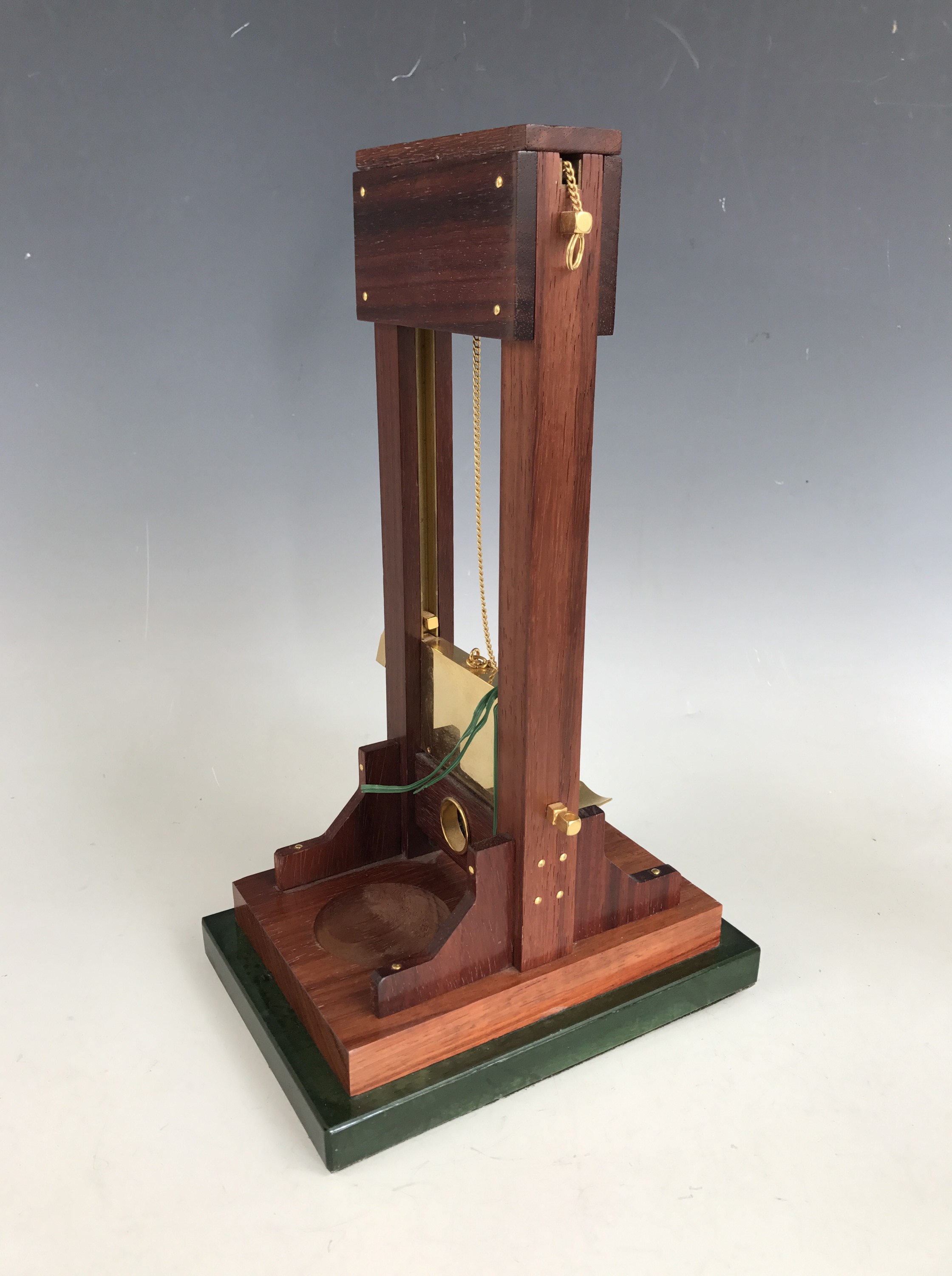 A table cigar cutter modelled as a guillotine, late 20th Century, 34 cm