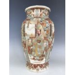 A Meiji Japanese Satsuma earthenware vase, of lobed ovoid form decorated in vignettes depicting