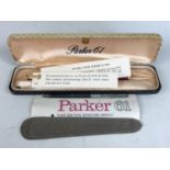 A cased Parker 61 fountain pen, having "Red Classic" barrel, gold-filled cap and capillary filler,