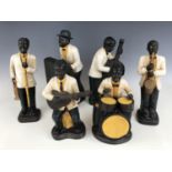 A group of six bisque figurines modelled as jazz musicians, 36 cm