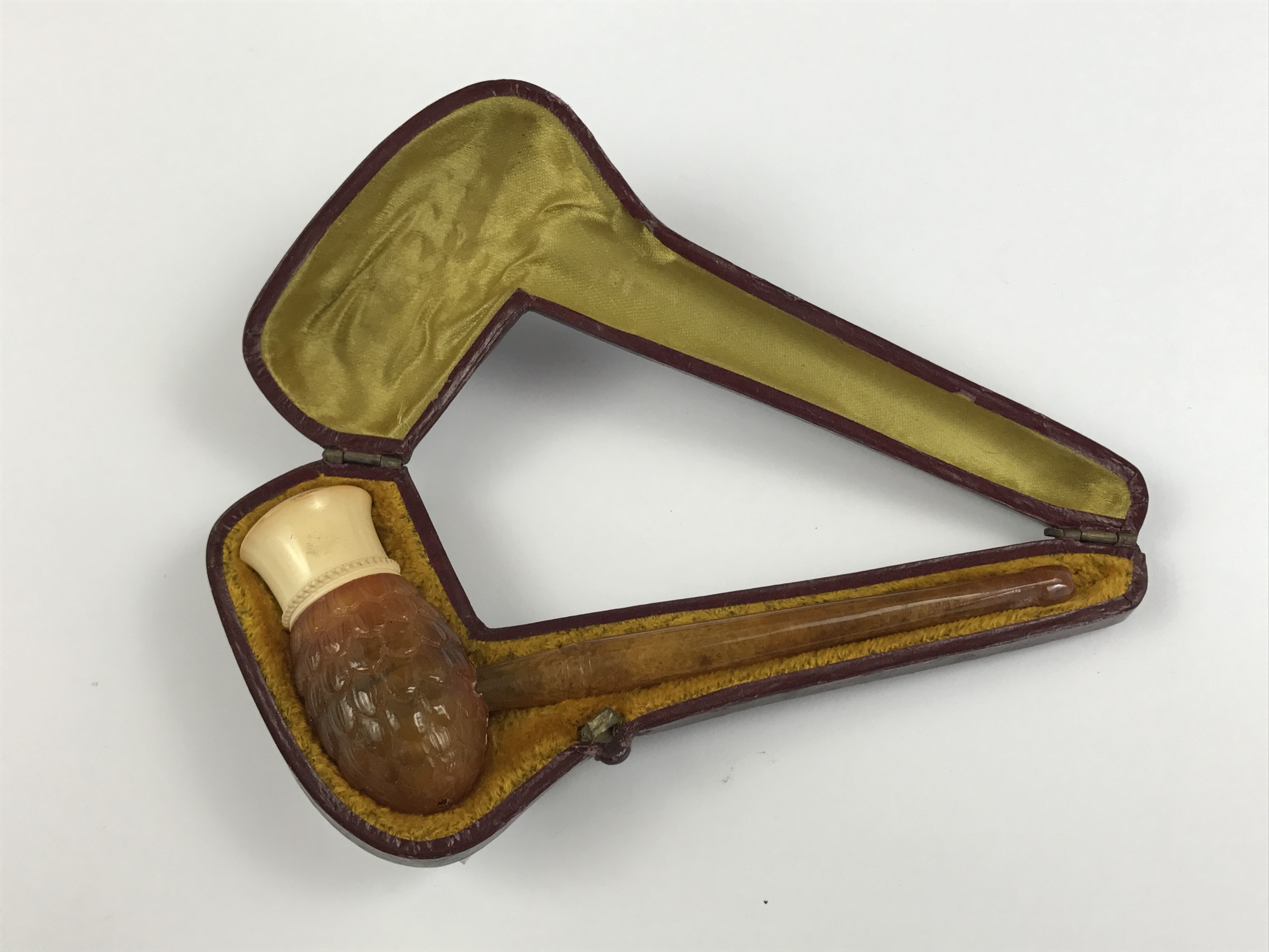 A late 19th / early 20th Century amber and meerschaum cigarette pipe, cased, 11 cm long