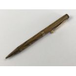 A 1920s 9ct gold mounted Waterman's Ideal "woodgrain" propelling pencil, London, 1928