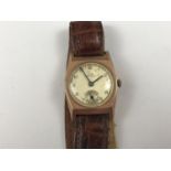 A 1940s gentleman's 9ct gold cased Record wrist watch, having a silvered face, subsidiary seconds