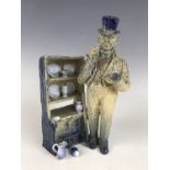 A Burgess & Leigh prototype figurine modelled as The Curio Collector, bearing E T Bailey's