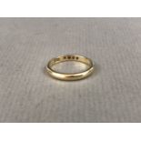 An 18ct gold wedding band, 2.7g