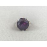 A vintage alexandrite cocktail ring, the circular cut stone of approximately 16 mm diameter, crown-