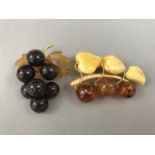 Two Russian amber brooches, each modelled in the form of a fruiting vine on rolled gold boughs