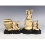 A pair of Japanese carved marine ivory sculptures depicting musicians, character marks to bases,