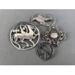 Four Shetland Silvercraft Scottish silver brooches, one being reticulated in the form of a