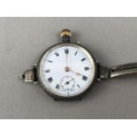 An early George V lady's silver cased fob watch converted to be worn on the wrist, together with a