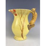 A Burgess and Leigh Burleigh Ware jug, the handle modelled as a squirrel, 18 cm [This lot is by