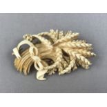 A Victorian ivory brooch carved in the form of a wheatsheaf, 7 cm